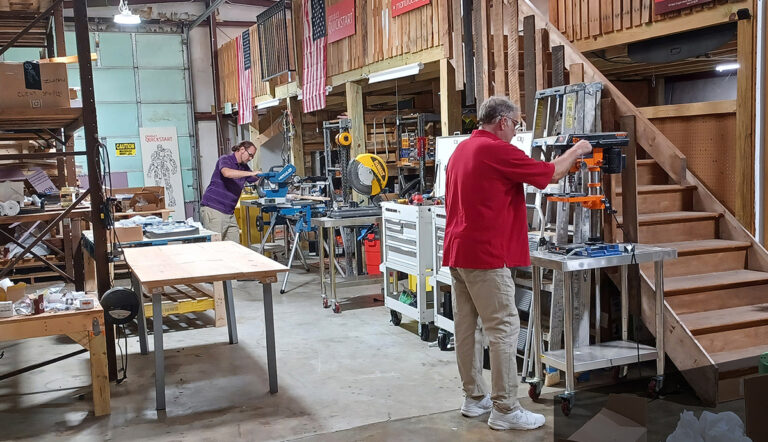 PQS Rapid Prototype Shop with men working